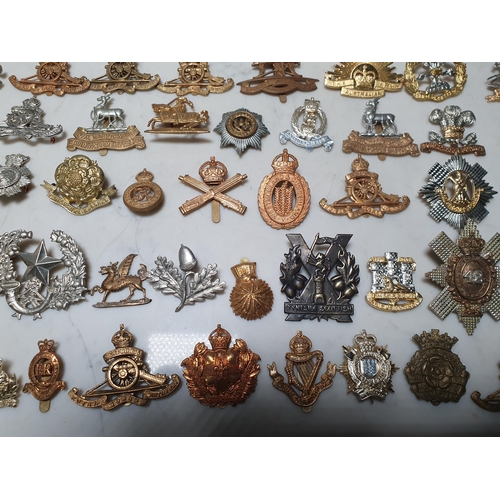 262 - A collection of approximately 50 Military Badges