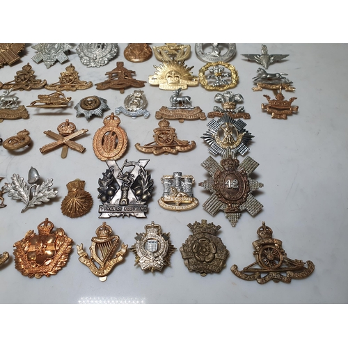 262 - A collection of approximately 50 Military Badges