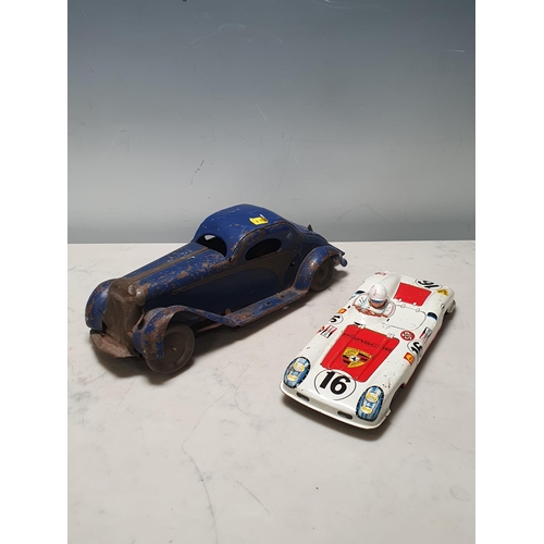 273 - A tinplate clockwork saloon Car and a tinplate Porsche Le Mans Car, both A/F (R8)