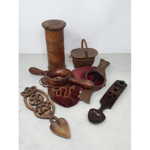 29 - A Treen Spice Tower A/F, two carved Spoons, two Offering Bags A/F, and a small wicker Basket.