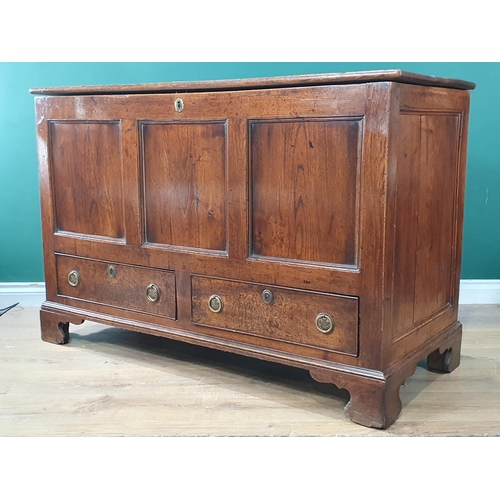 298 - An 18th Century oak and elm Mule Chest with fielded three panel front above two drawers raised on br... 