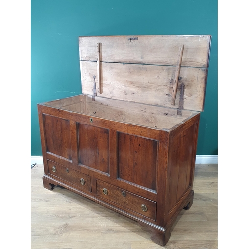 298 - An 18th Century oak and elm Mule Chest with fielded three panel front above two drawers raised on br... 