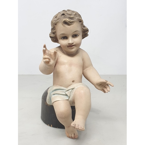 32 - A plaster Putti with glass eyes, A/F.