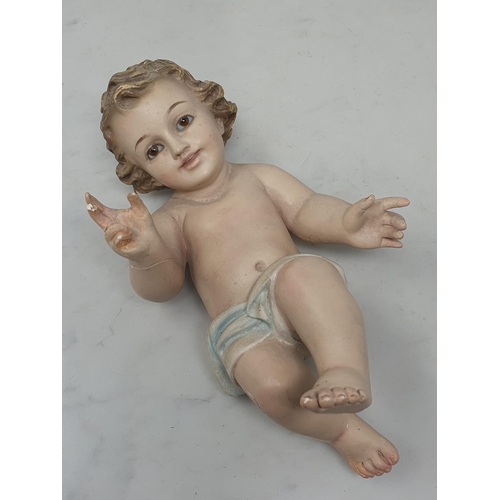 32 - A plaster Putti with glass eyes, A/F.