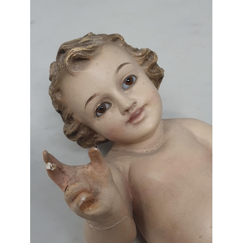 32 - A plaster Putti with glass eyes, A/F.