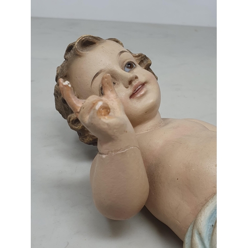 32 - A plaster Putti with glass eyes, A/F.