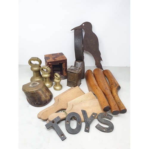 39 - An antique Horse Hoof Inkwell, Butter Pats, brass Weights, Bow Bell, Money Box, 'TOYS' metal Letters... 