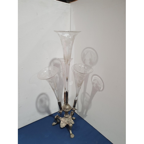 457 - A Table Epergne, with four glass flutes, the plated base on three paw supports (Mez)