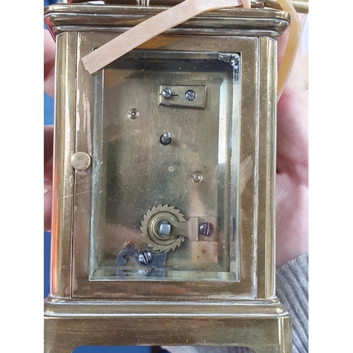 458 - A small brass Carriage Clock with white enamel dial, with key (Mez)