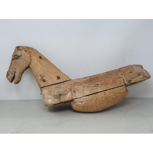 476 - A folk art carved wooden Model of a Horse (lacking legs) 20in x 12in, a leather covered toy Horse A/... 