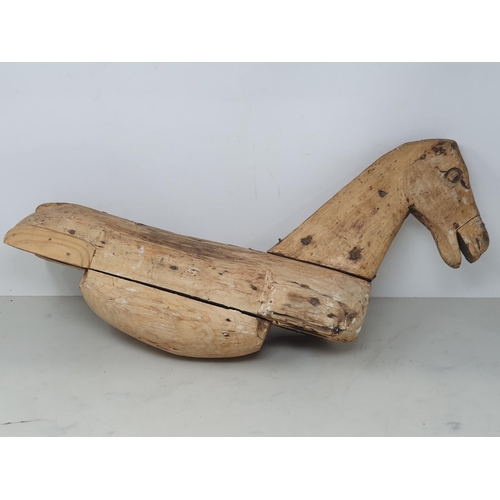 476 - A folk art carved wooden Model of a Horse (lacking legs) 20in x 12in, a leather covered toy Horse A/... 