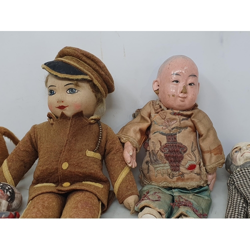 488 - A fabric Doll in G.W.R. Uniform, a Chinese Doll in traditional costume, two antique plaster Dolls, a... 