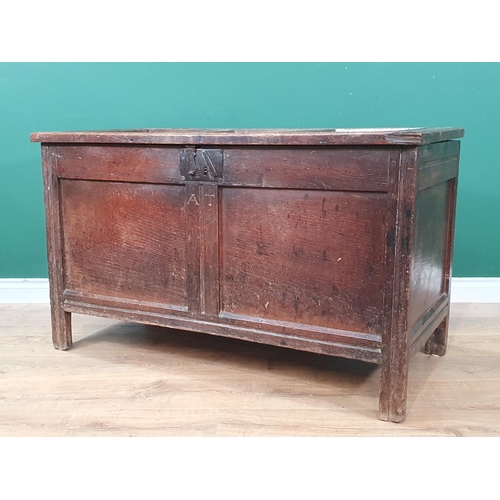 506 - An 18th Century joined oak Coffer with sunken three panel lid above two panel front with initials 'A... 