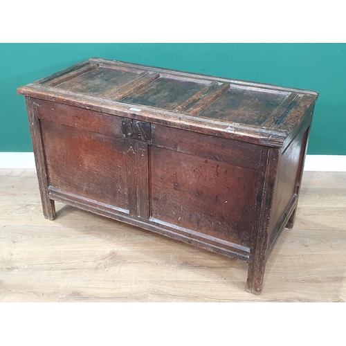 506 - An 18th Century joined oak Coffer with sunken three panel lid above two panel front with initials 'A... 