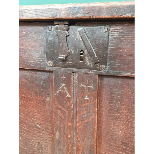 506 - An 18th Century joined oak Coffer with sunken three panel lid above two panel front with initials 'A... 