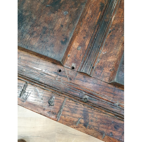 506 - An 18th Century joined oak Coffer with sunken three panel lid above two panel front with initials 'A... 