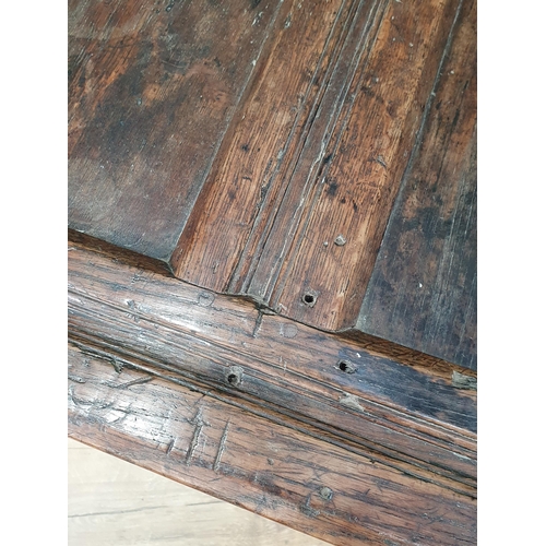 506 - An 18th Century joined oak Coffer with sunken three panel lid above two panel front with initials 'A... 