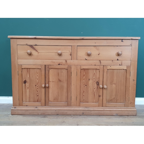 507 - A pine Dresser Base fitted two frieze drawers above four cupboard doors 4ft 11in W x 3ft 1in H (R3)