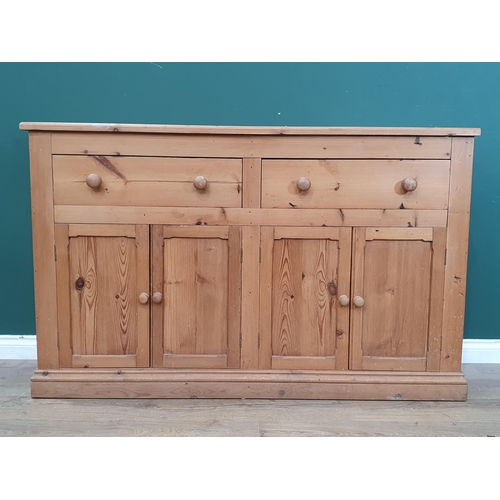 507 - A pine Dresser Base fitted two frieze drawers above four cupboard doors 4ft 11in W x 3ft 1in H (R3)