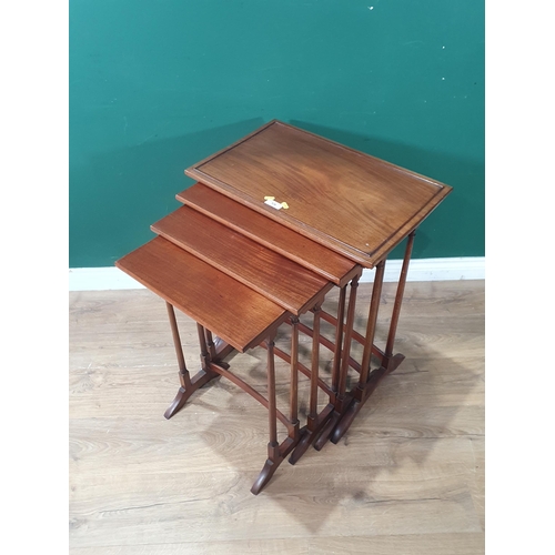 526 - A 19th Century mahogany quartetto Nest of Occasional Tables raised on slim turned supports 2ft 4in H... 