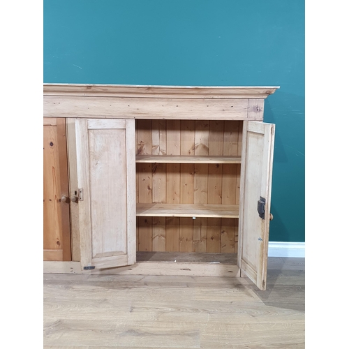 575 - An antique pine Cupboard fitted four fielded panel doors 5ft 1in W x 3ft 6in H (R2)