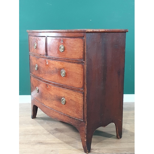 586 - A 19th Century mahogany bow fronted Chest of two short and two long drawers on splayed feet 2ft 11in... 