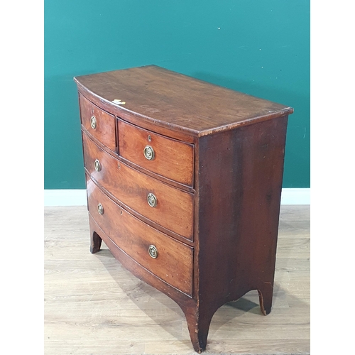 586 - A 19th Century mahogany bow fronted Chest of two short and two long drawers on splayed feet 2ft 11in... 