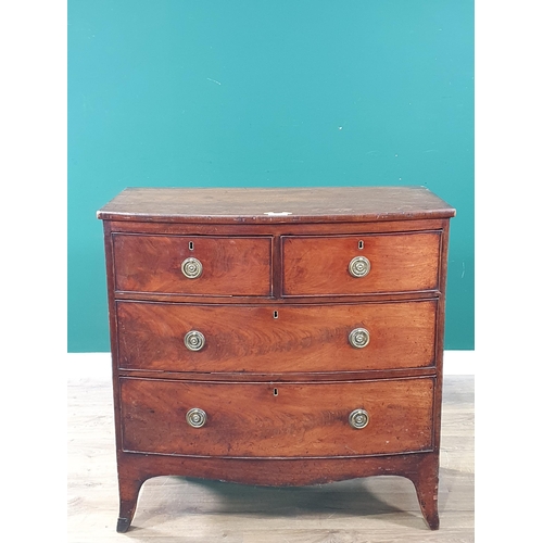 586 - A 19th Century mahogany bow fronted Chest of two short and two long drawers on splayed feet 2ft 11in... 