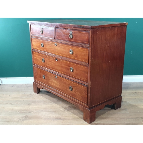 589 - A 19th Century mahogany Chest of two short and three long drawers with satinwood stringing mounted o... 