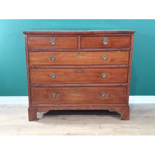 589 - A 19th Century mahogany Chest of two short and three long drawers with satinwood stringing mounted o... 