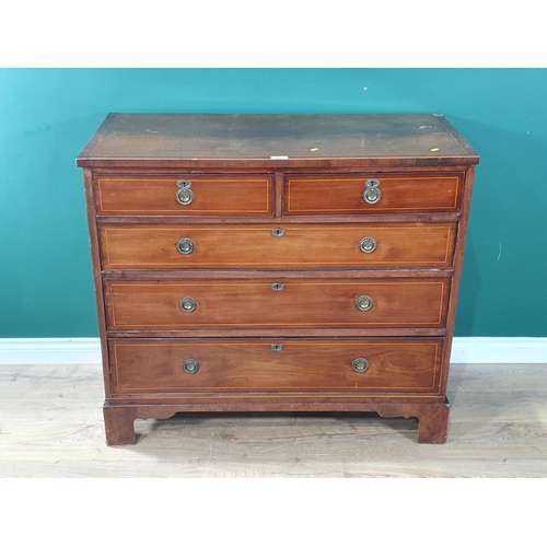 589 - A 19th Century mahogany Chest of two short and three long drawers with satinwood stringing mounted o... 