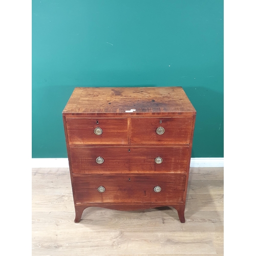 629 - A 19th Century mahogany and satinwood strung Chest of two short and two long drawers raised on splay... 