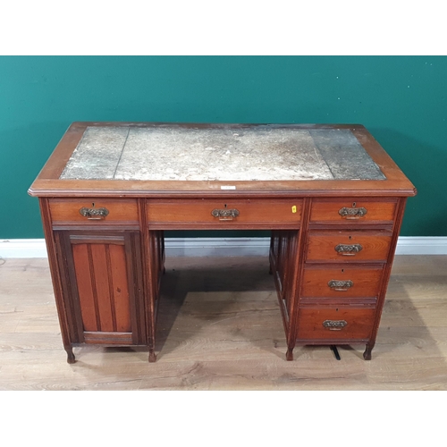 634 - An Edwardian walnut Pedestal Desk fitted three frieze drawers and three drawers to one pedestal and ... 