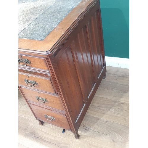 634 - An Edwardian walnut Pedestal Desk fitted three frieze drawers and three drawers to one pedestal and ... 