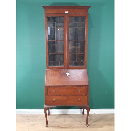 635 - A mahogany veneered Bureau Bookcase with glazed upper section above base fitted two drawers raised o... 