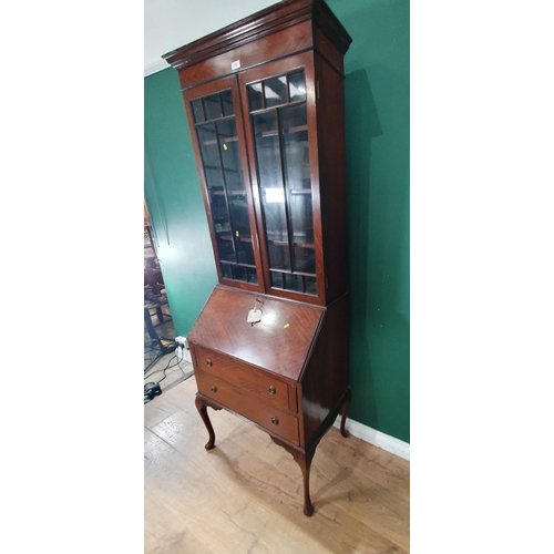 635 - A mahogany veneered Bureau Bookcase with glazed upper section above base fitted two drawers raised o... 