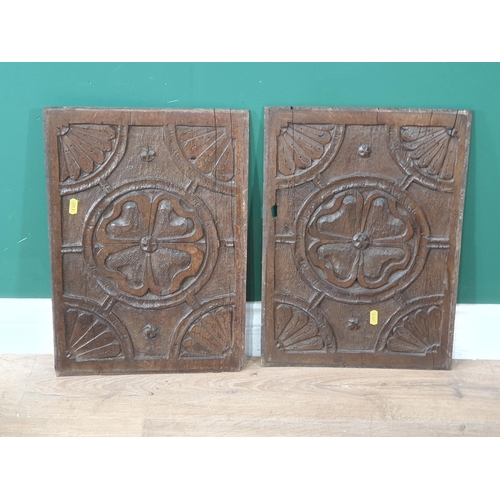 698 - A pair of 17th Century oak Panels with carved quatrefoil within roundel 1ft 6in X 1ft 1in (R9)