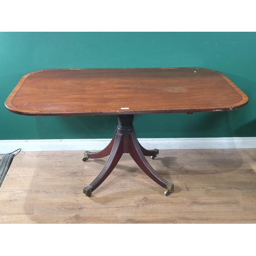 73 - A Regency mahogany Breakfast Table, the cross banded rectangular top on a turned pedestal and four s... 