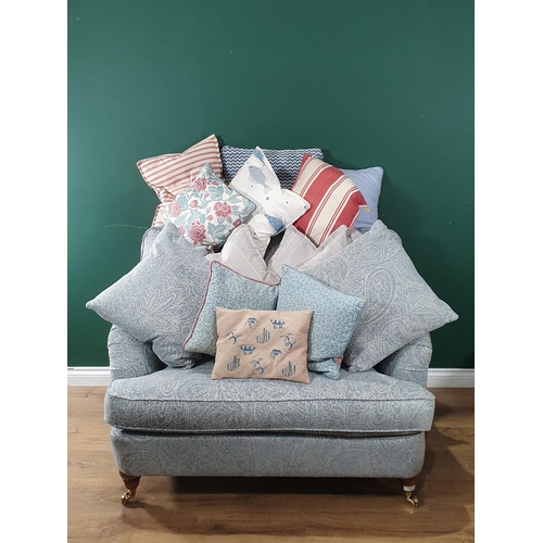 749 - A blue upholstered two seater Sofa on turned supports 3ft 10in W x 2ft 10in H and a quantity of Cush... 