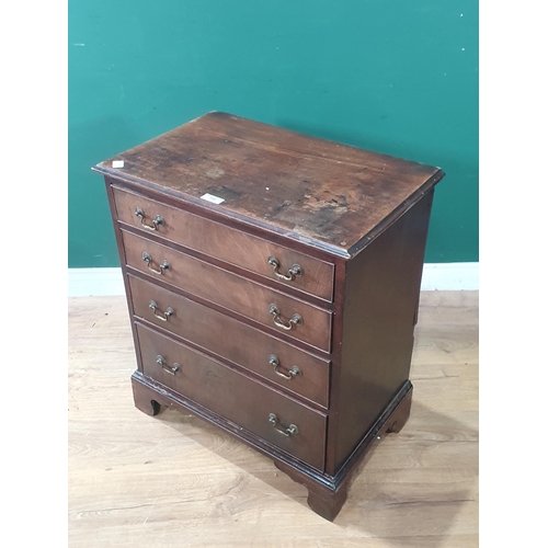 750 - A Georgian mahogany Chest of small proportions fitted four graduated drawers raised on ogee bracket ... 