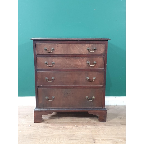 750 - A Georgian mahogany Chest of small proportions fitted four graduated drawers raised on ogee bracket ... 