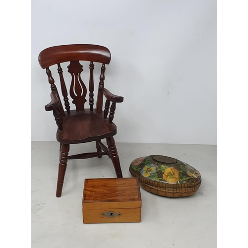 8 - A doll's mahogany Windsor Elbow Chair, a small wooden money Box and a Rowntree Tin