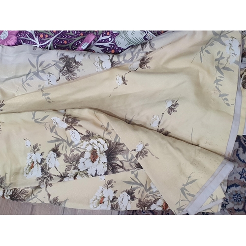 807 - A pair of yellow ground Curtains with blossom design 4ft 4in L x 9ft W, a purple pair of Curtains wi... 