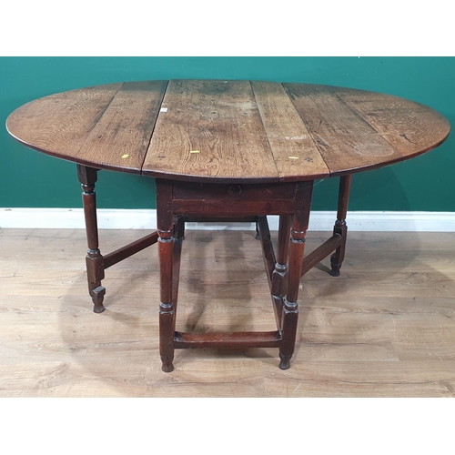 84 - An 18th Century oak Gateleg Table fitted end drawer raised on barrel turned supports 3ft 8in W x 2ft... 