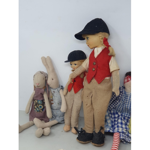 9 - Two fabric Rabbits, two plastic headed girl Dolls in riding costume, a frog soft toy, assorted Books... 