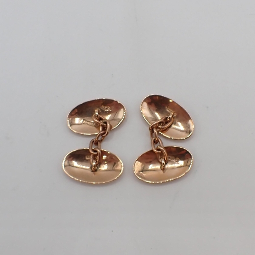 203 - A pair of 9ct gold oval Cufflinks engraved monograms, approx 8gms