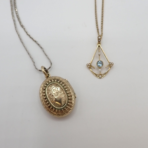 204 - An Edwardian Aquamarine and Seed Pearl Pendant millegrain-set round aquamarine within openwork drop ... 