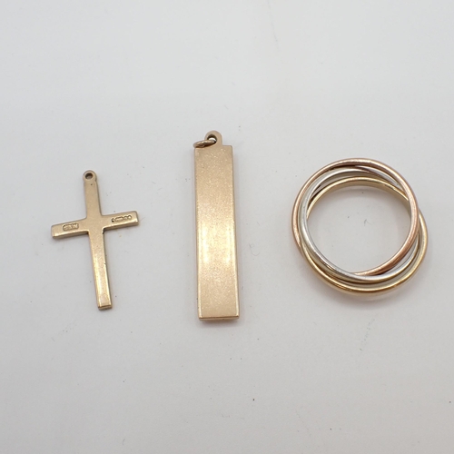 205 - A 9ct gold Ingot Pendant, a small 9ct gold Cross and a 9ct gold tricolour Russian Wedding Ring, appr... 