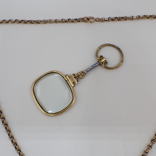 219 - A 19th Century Spy Glass in yellow metal frame with blue enamel to handle on fancy link Chain marked... 