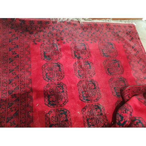 800 - A multi bordered Bokhara Carpet with three rows of seven large guls on a red ground, 7ft 3in x 10ft ... 